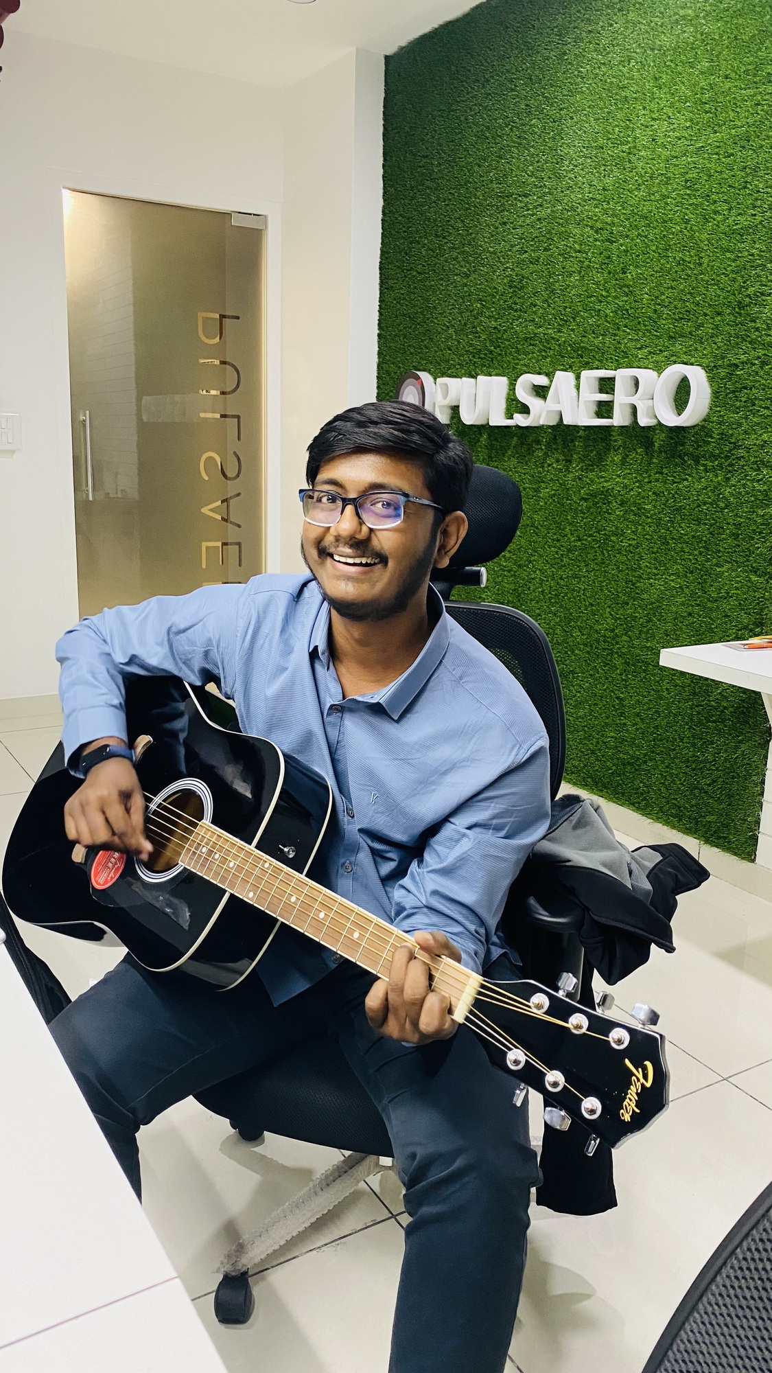 Kushal playing guitar
